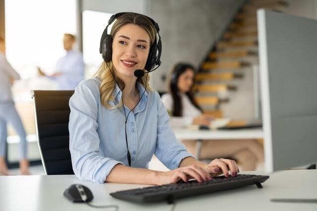 Editor responding to reader messages in a modern office