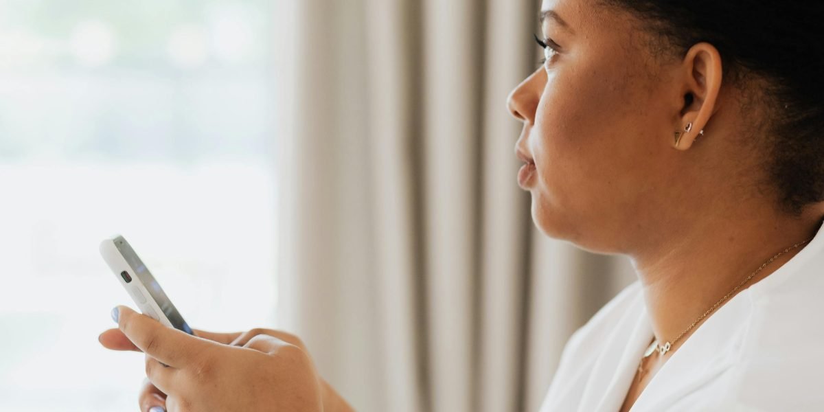A person engrossed in a mobile puzzle game during a quick break, finding a moment of mental engagement.