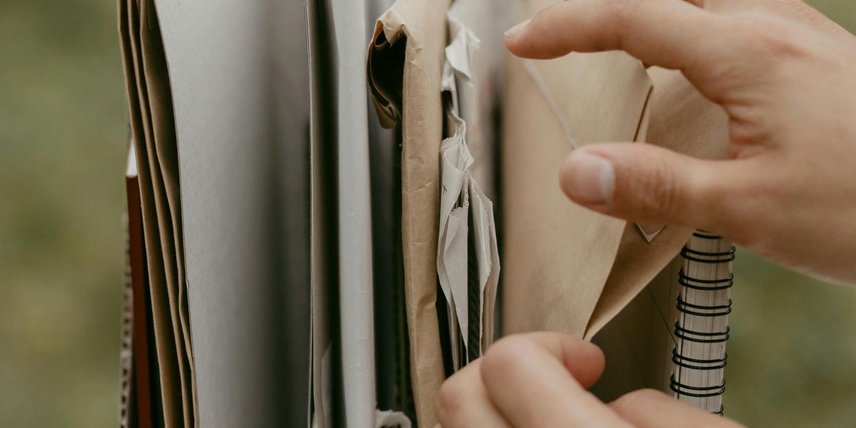 A person thoughtfully arranging files, symbolizing the desire for a well-organized and personalized digital space on their phone.