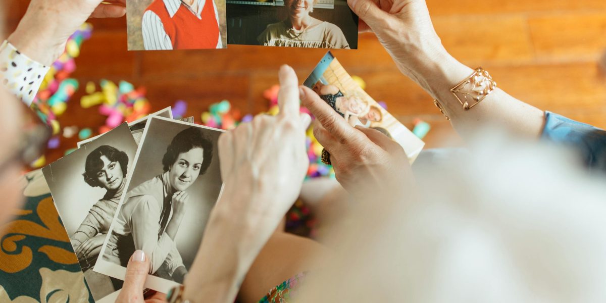 People sharing cherished memories on a smartphone, highlighting the social aspect of photo management.