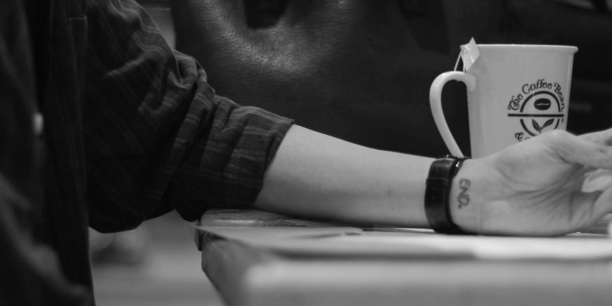 A person effectively using a mobile device for work or creative tasks, emphasizing on-the-go productivity.