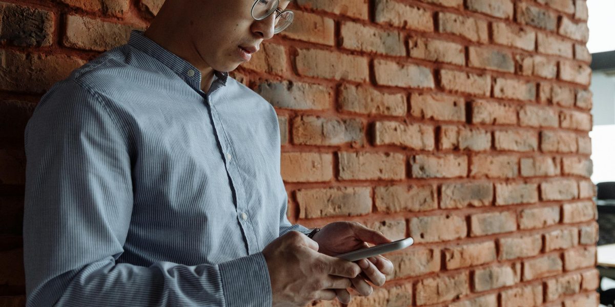 A person intently reading news on a tablet, reflecting on the rapid pace of technological advancements.