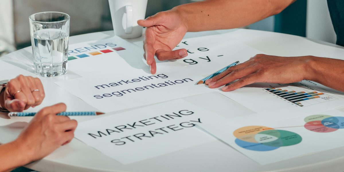 A team in a meeting analyzing market trends and competitive products, similar to the smartphone market in 2011.