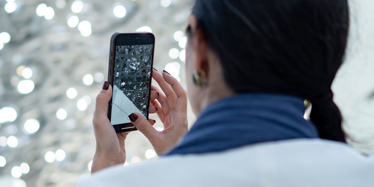 A person appreciating the original aesthetic of their smartphone without a bulky case.