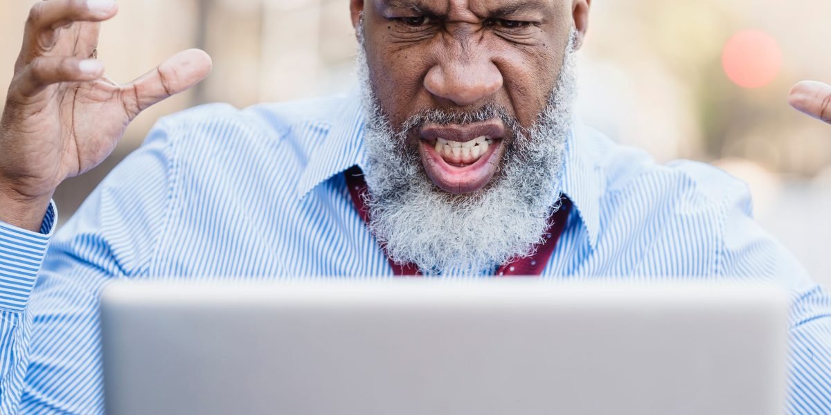 A person expresses frustration during a video call, highlighting the productivity impact of slow internet speeds.