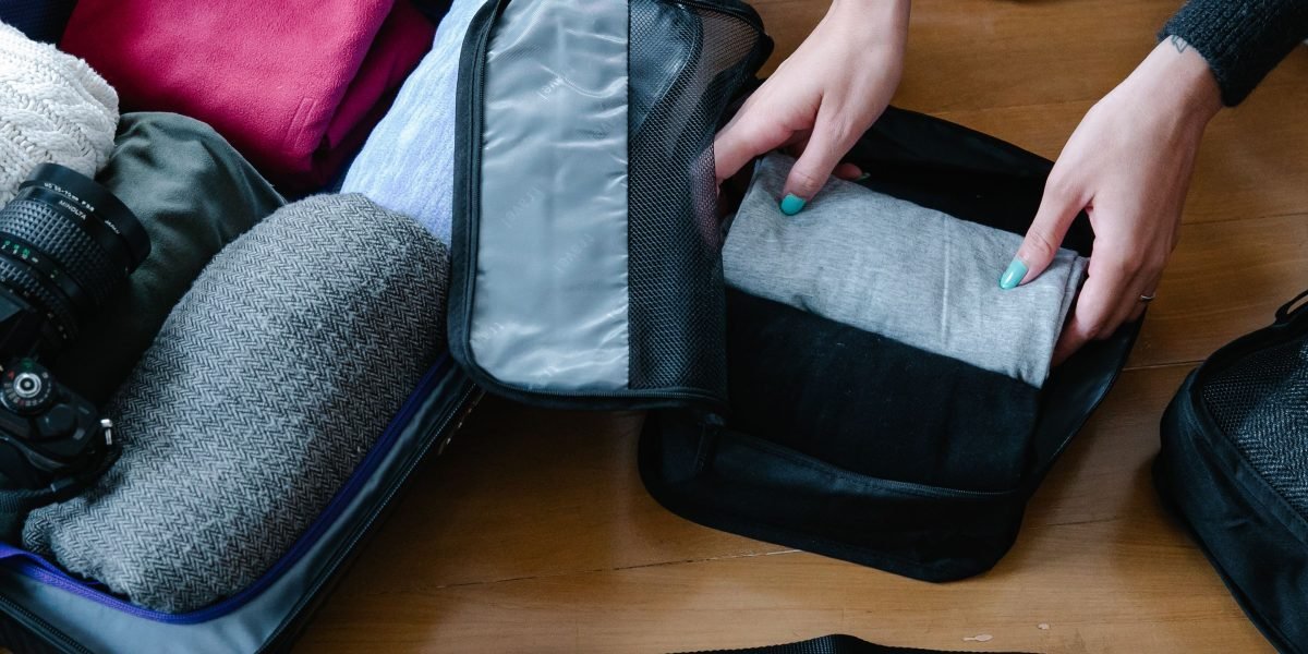 A person meticulously cleaning or organizing a personal item, showcasing the care involved in preparation.