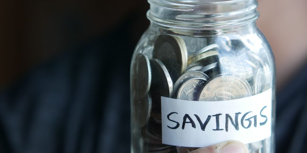 An individual looks satisfied, having successfully found smart ways to save money on a significant purchase.