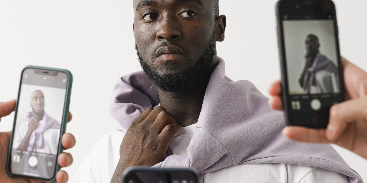 A person carefully evaluates different smartphone options to find the right balance of features and price.