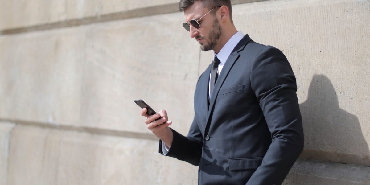 A person confidently using their smartphone, demonstrating seamless performance in daily tasks.
