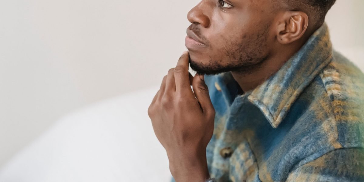 A person thoughtfully considering options, making an informed decision about a product.