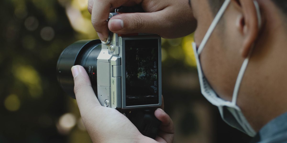 A person capturing a beautiful moment with their smartphone camera, enhancing their photography skills.