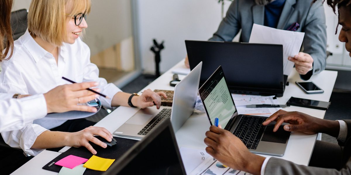 A diverse team collaborating in a dynamic workspace, symbolizing the creative energy of startups developing new products.