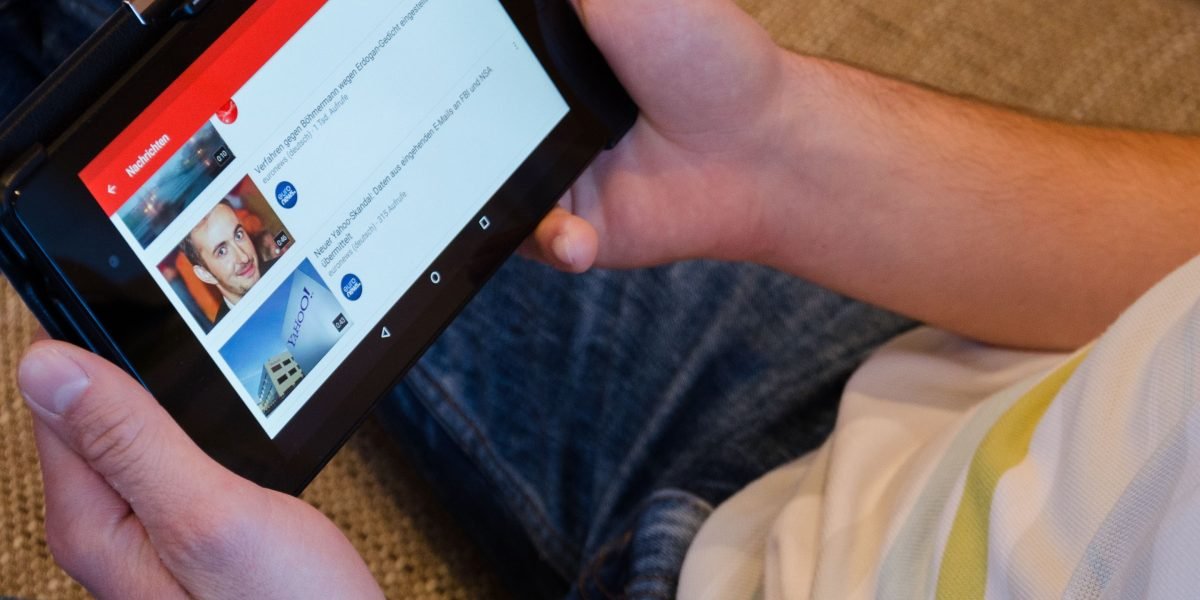 A person enjoying seamless video playback on their phone, highlighting extended battery life.