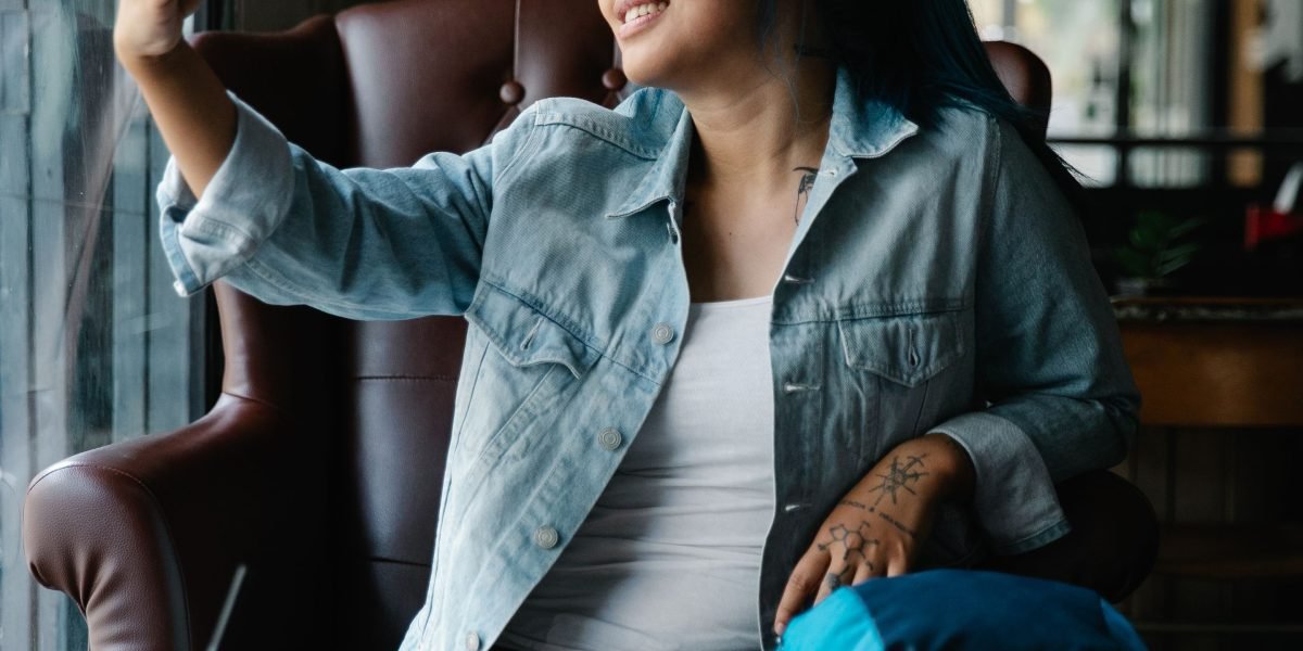 A person captivated by content on a smartphone screen, reflecting the immersive visual experience offered by high-quality displays.