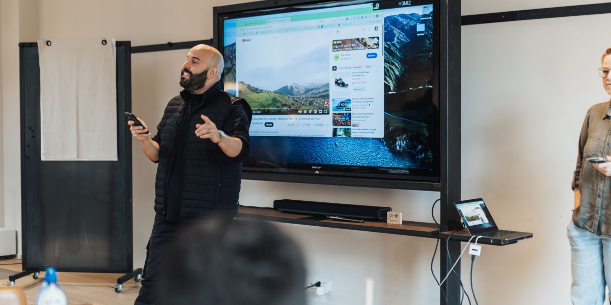 A professional delivering a presentation, utilizing a remote control device for seamless navigation through slides, enhancing engagement.