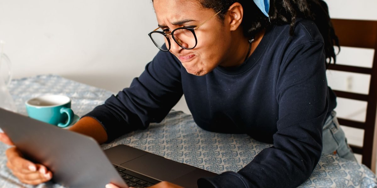 A person looks perplexed while browsing products on an online marketplace, highlighting common uncertainties about legitimacy.