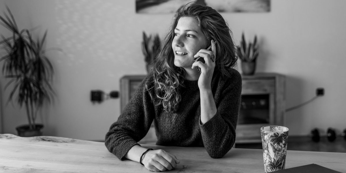 A person looking slightly frustrated or distracted by their phone, symbolizing overwhelming notifications.