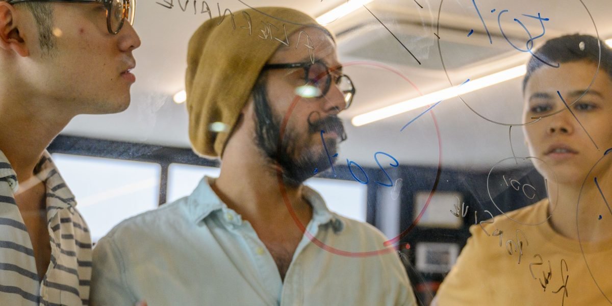 A team actively collaborating, symbolizing the foundational work and mission behind building location data platforms.