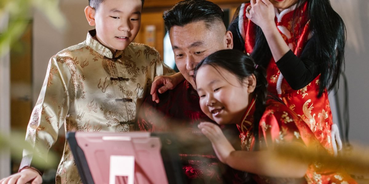 A family enjoys fast internet in a rural setting, symbolizing global connectivity.