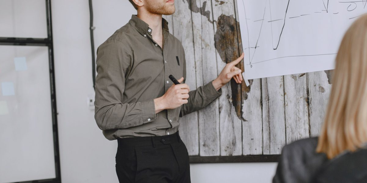 A leader presenting an ambitious vision to a team, embodying strategic drive.
