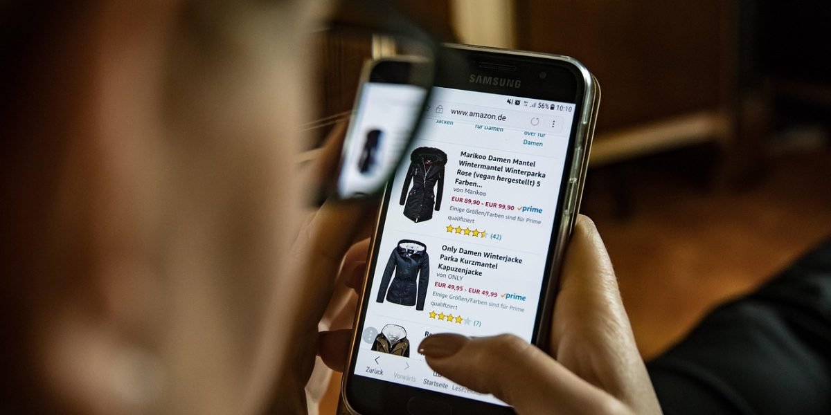 A person contemplates various options and potential choices when shopping online for new gadgets.