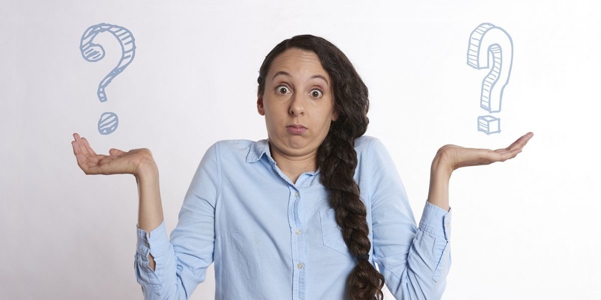 A person actively comparing different product options, possibly on a tablet or multiple screens, to make an informed decision.