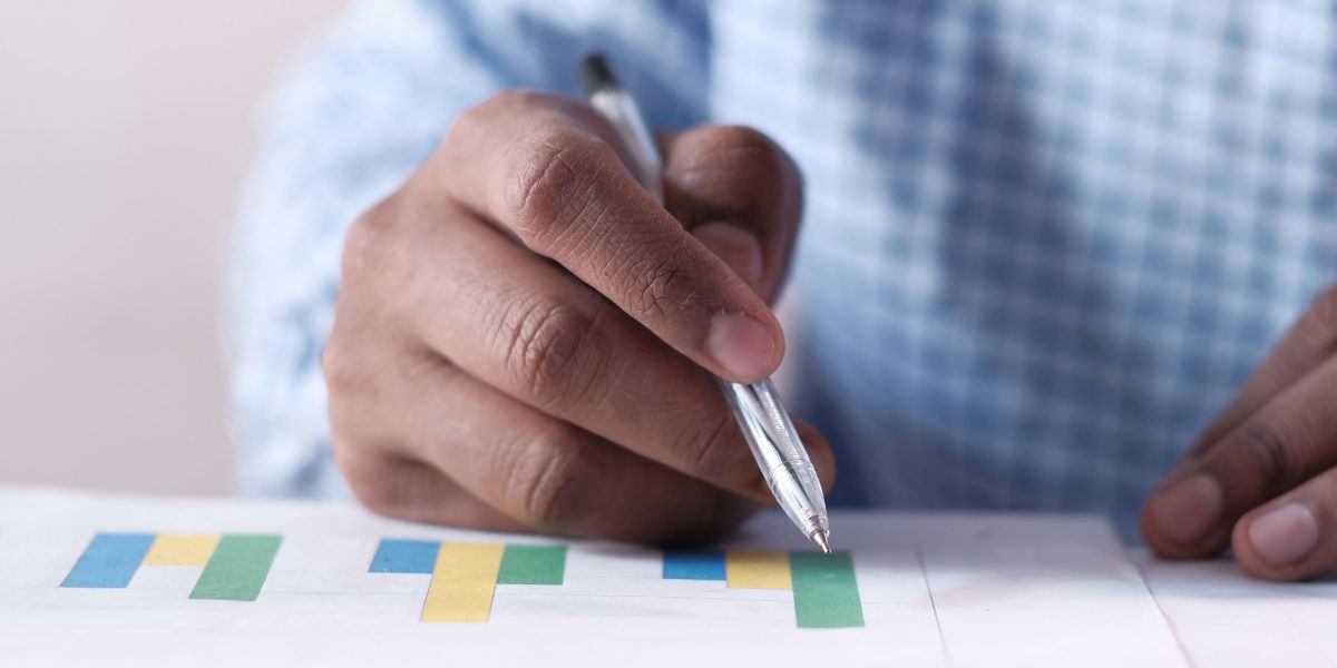 A person engaged in thoughtful review, navigating a flow of information to avoid feeling overwhelmed.