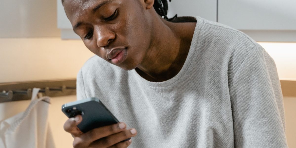 A person exhibiting carefulness while navigating online content, emphasizing the need to avoid suspicious downloads or requests.