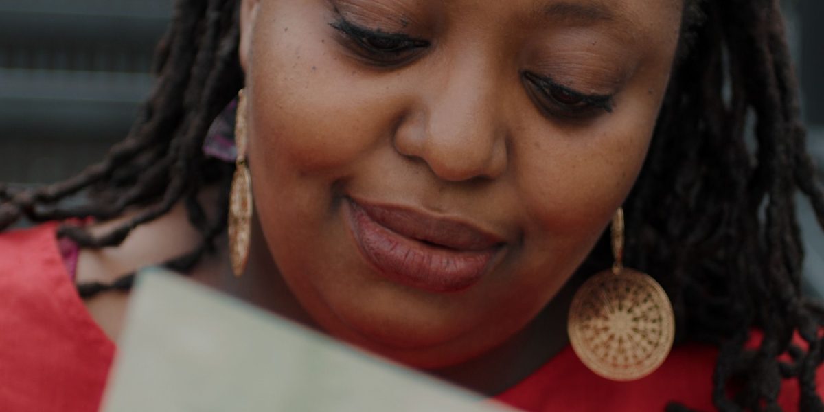 A person intently reading a guide or document, representing the act of learning and understanding complex information.