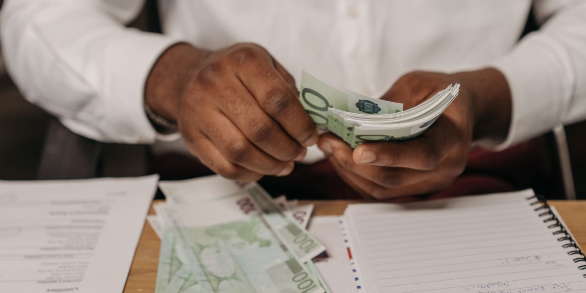 A person strategically planning their budget or purchase decisions to maximize value.