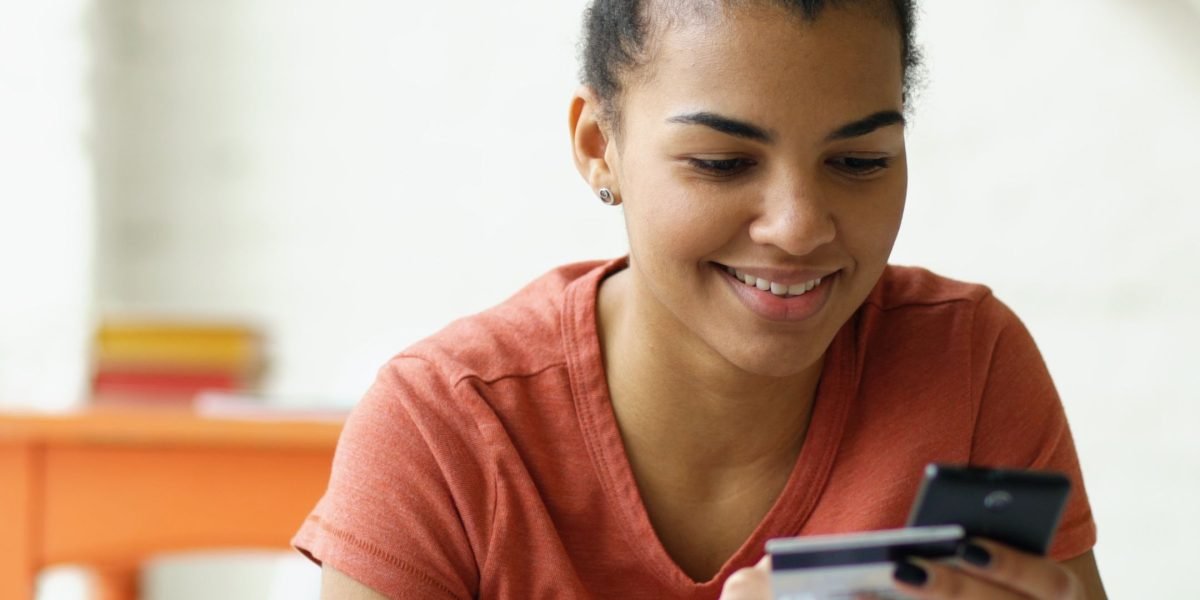 A person carefully considering their options before making a purchase decision.
