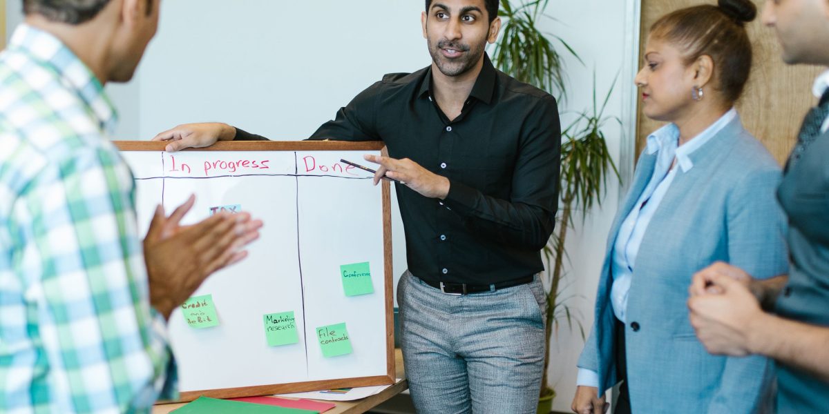 A team of professionals collaborates on business strategies, reflecting the vibrant AI startup investment scene.