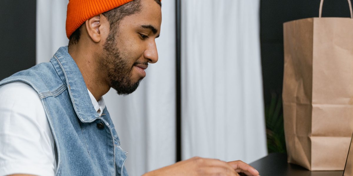 A person thoughtfully browsing online, considering items for future purchase or sharing as gift ideas.