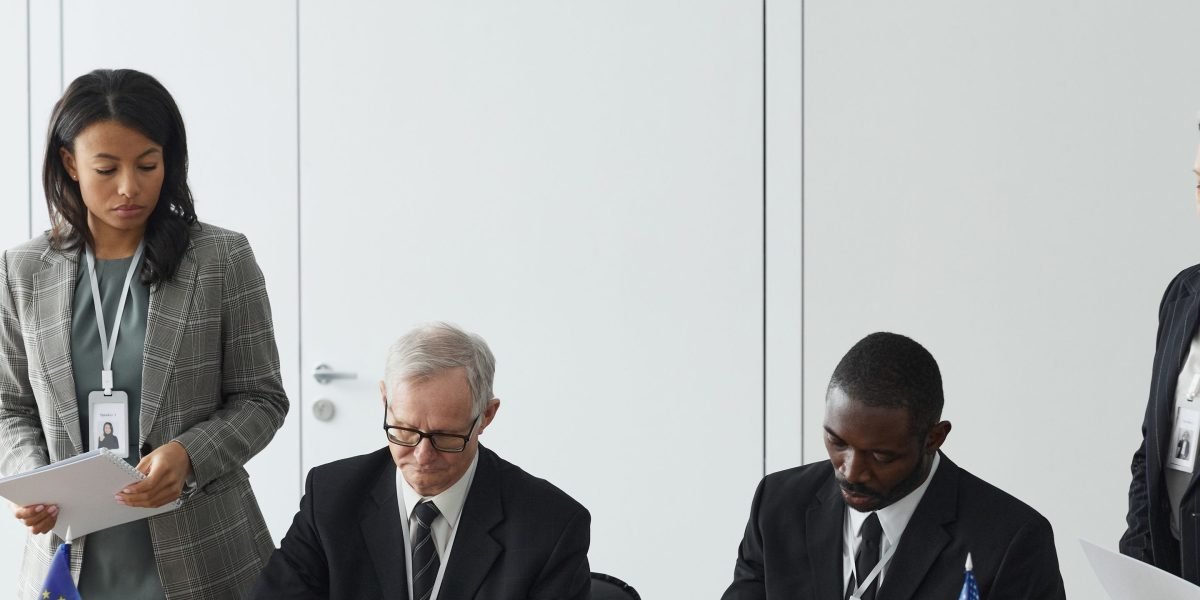 Business leaders engage in a formal meeting with government representatives.