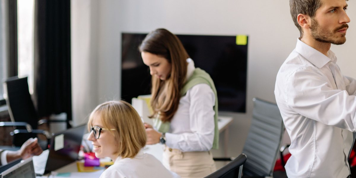 A professional actively planning their workday using a whiteboard, reflecting efficient time management.