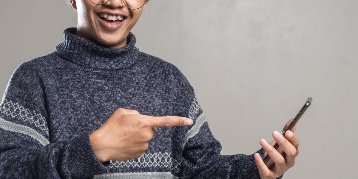 A person confidently holding their phone, symbolizing the security and protection of their valuable device.
