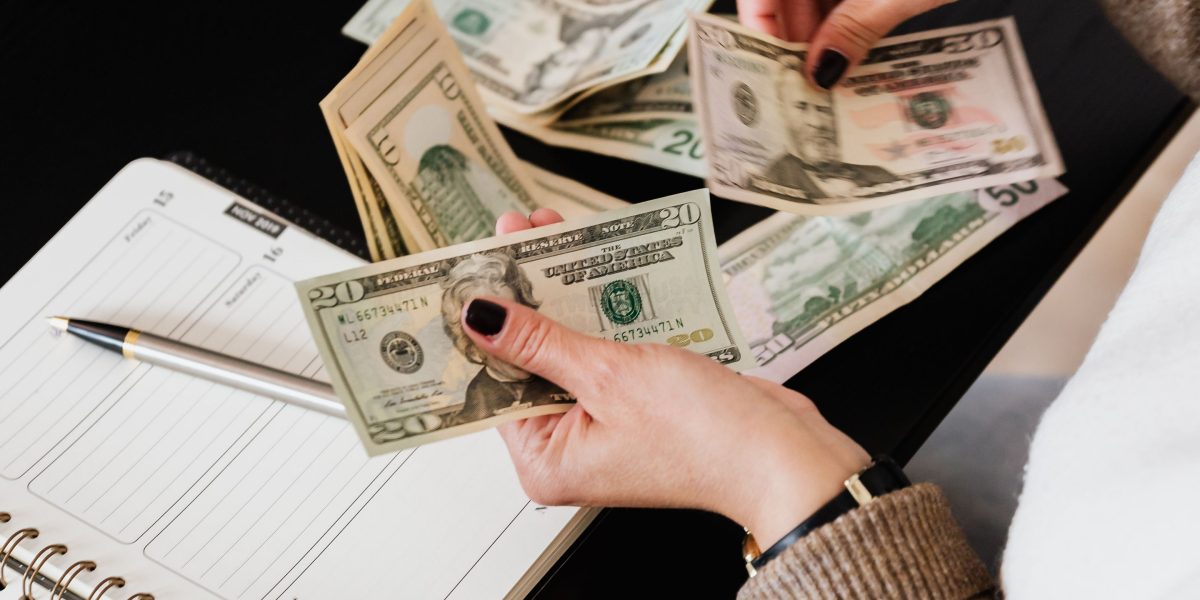 A person thoughtfully plans their budget and savings, utilizing various programs to maximize discounts.
