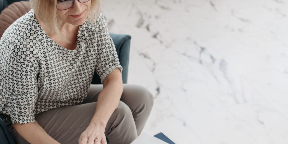 A person carefully comparing options to make a smart buying decision.