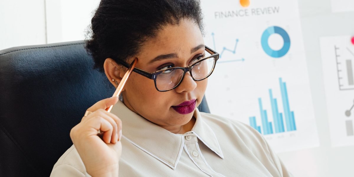A person reviewing financial documents, planning for a significant purchase like a smartphone.